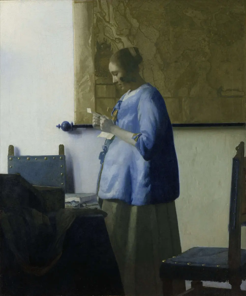 Woman in Blue Reading a Letter — Johannes Vermeer